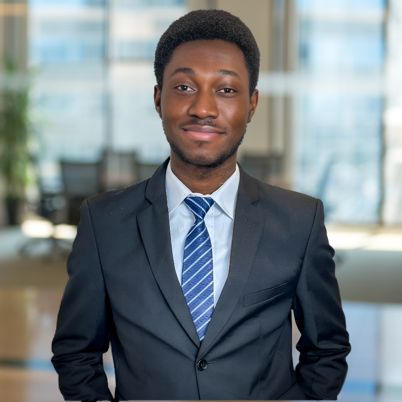 a young professional man in black suit